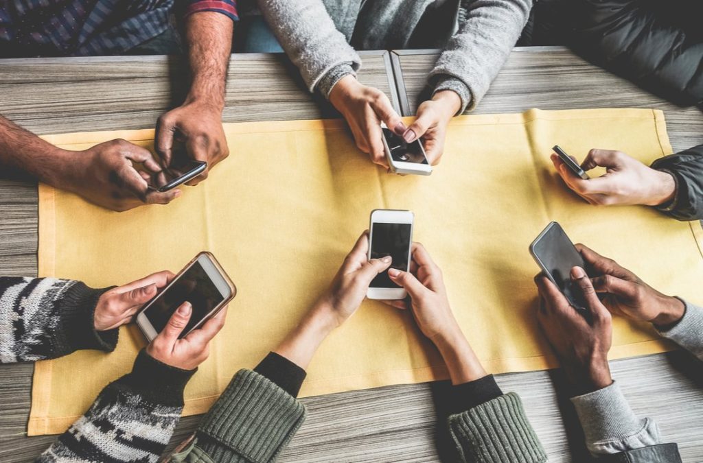 Group of friends with mobile phones