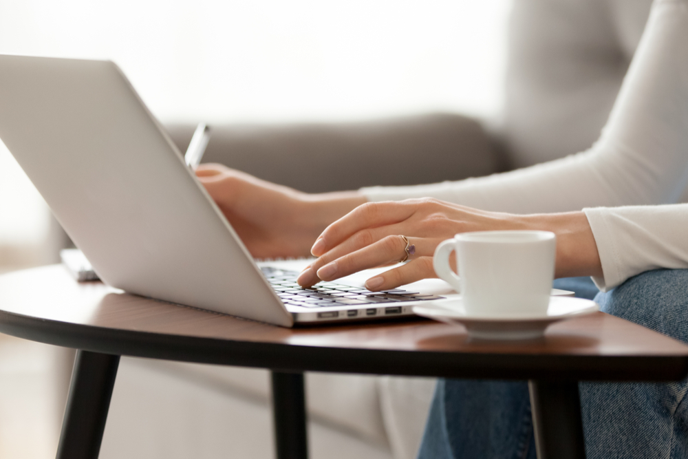 Close up woman using laptop 